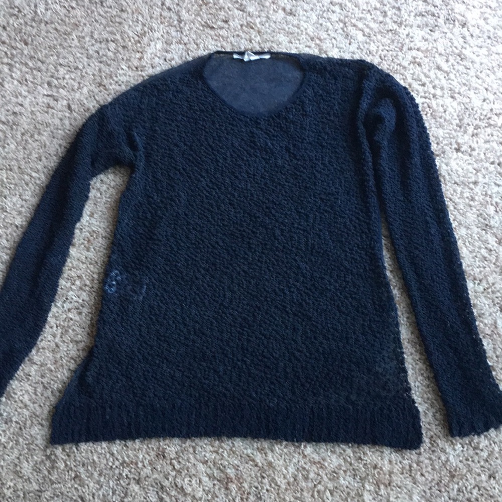 A sheer backed long sleeved sweater